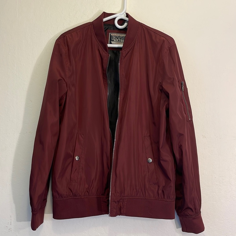 Civil Sektor Burgundy Bomber Jacket with pockets on sides. Size Large